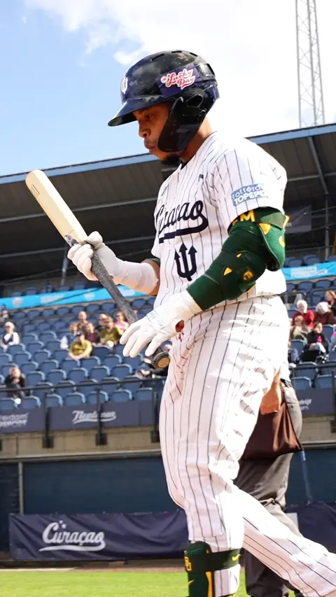 Dwayne Kemp goes into the batter's box