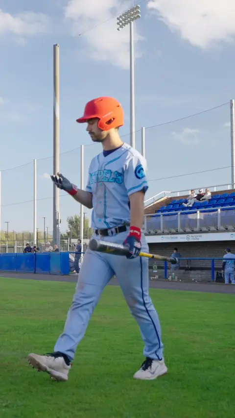 Mitchel Den Ouden walks up to the plate