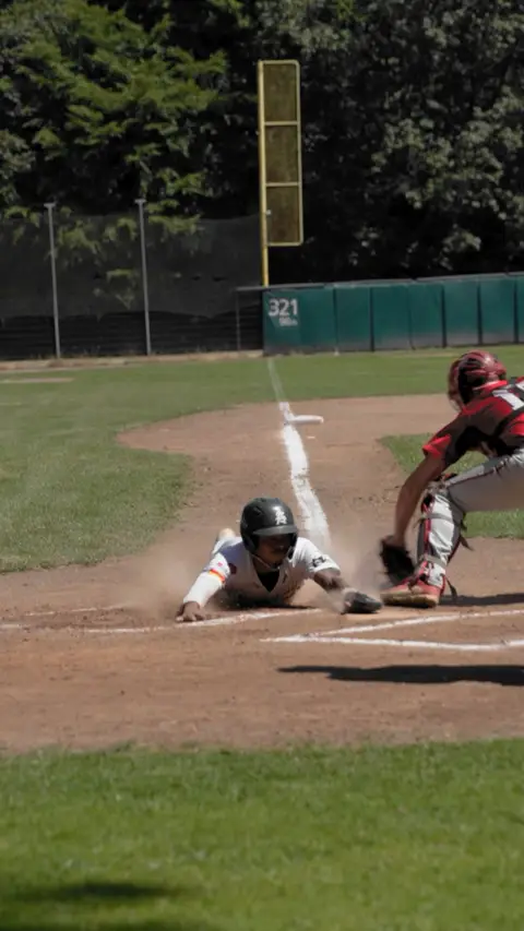 Kielan Lamaar sliding into home headfirst