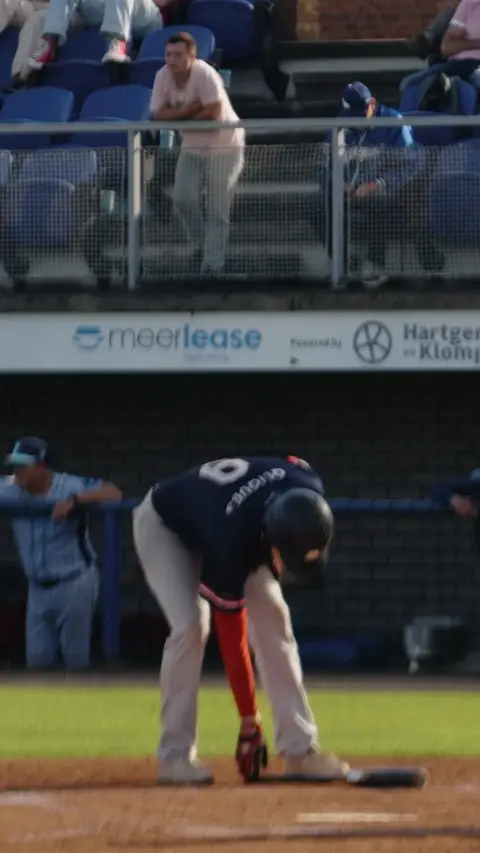 Nr. 9 from the Hawks walks up to the plate