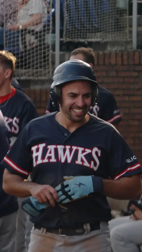 Pol Cortes scores and gives high fives through the dugout