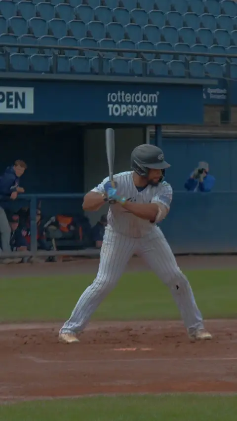 Dre Celestijn walks to first base