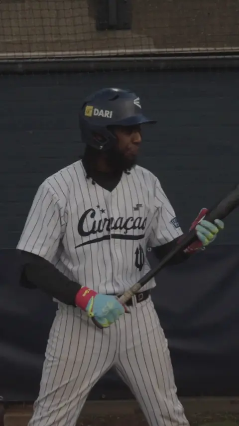 Gregory Trinidad walks up to the plate