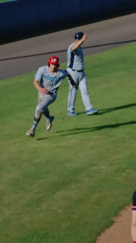 Menno Leeflang gets high fives after coming over homeplate