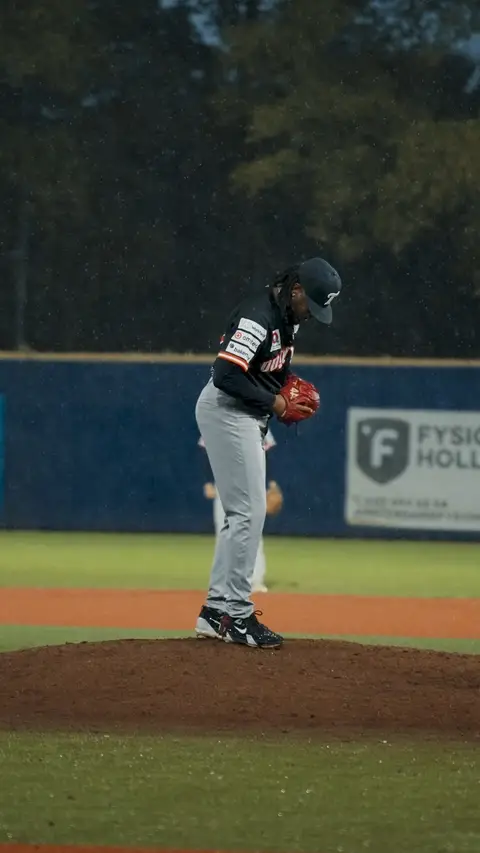 Nelmerson Angela pitching in the rain