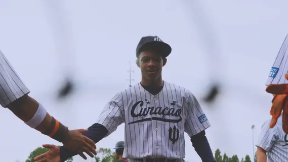 Keshawn Francisco giving high fives after coming out of the inning