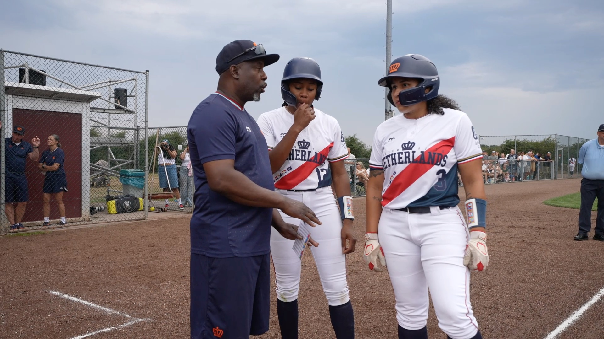 Eugene Henson talks to players
