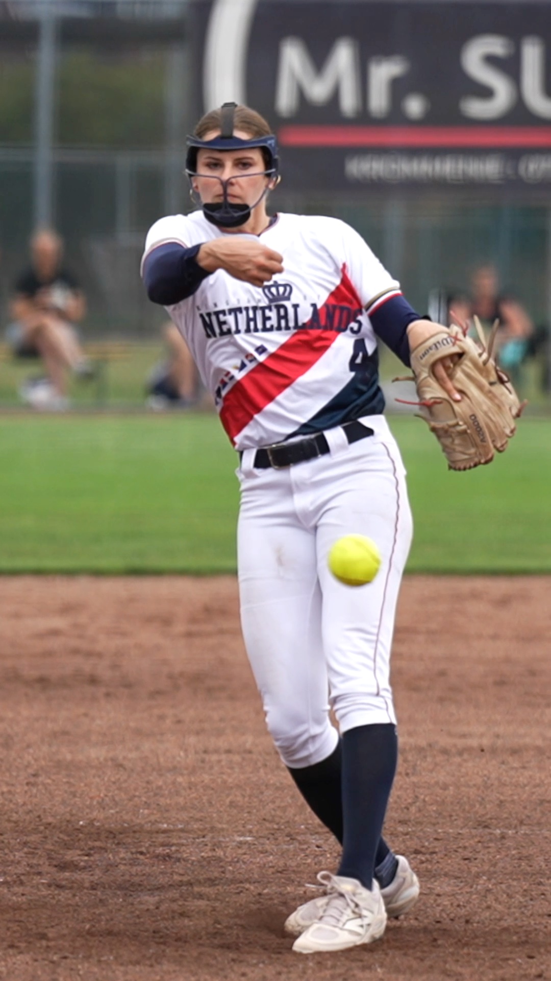 Lisa Hop pitching (backstop view)