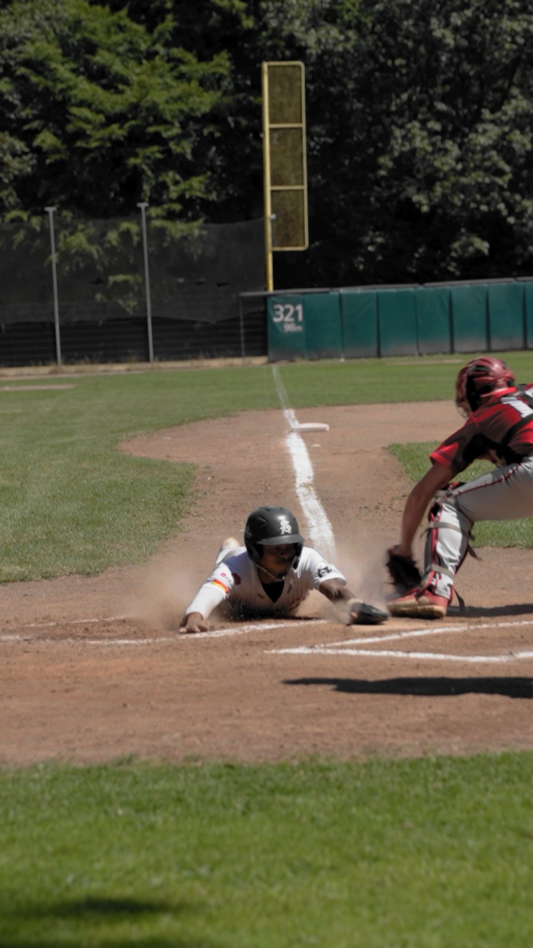 Kielan Lamaar sliding into home headfirst