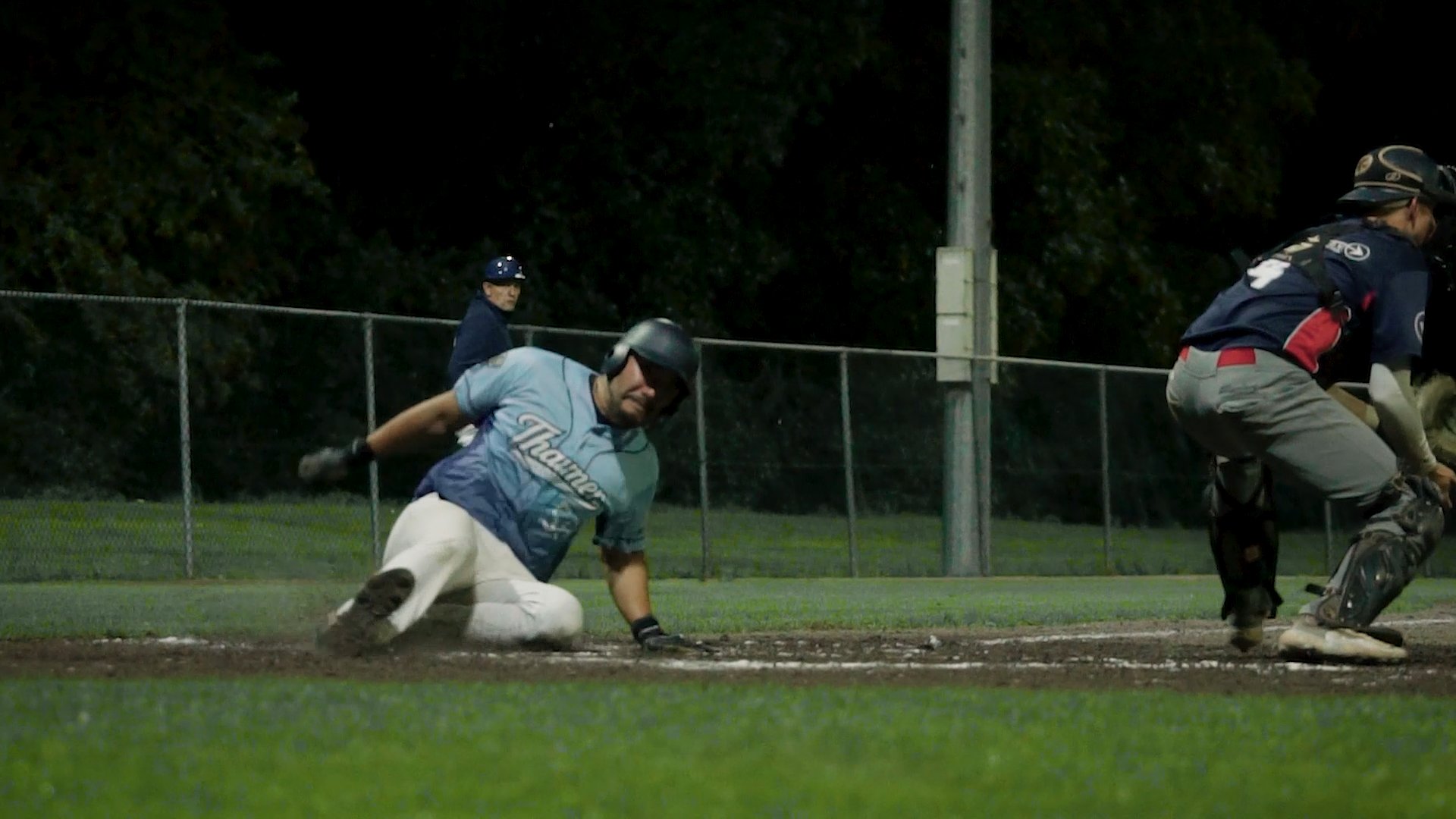 Takato Hishida slides home