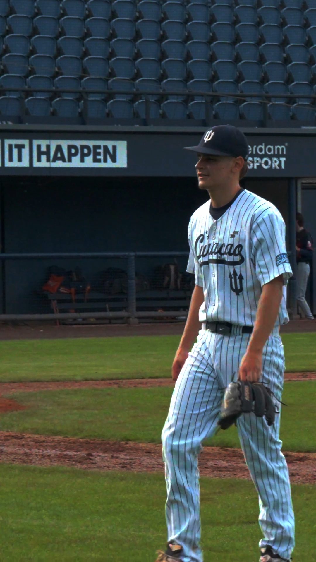 Dean Moust walks off the field after closing the inning