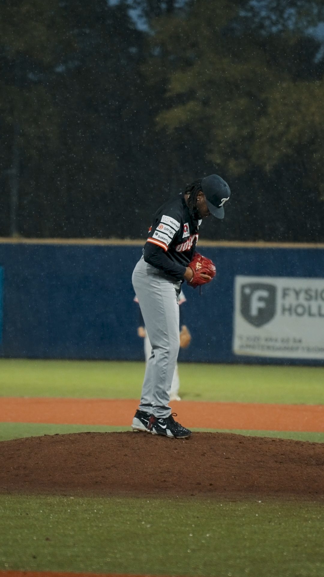 Nelmerson Angela pitching in the rain