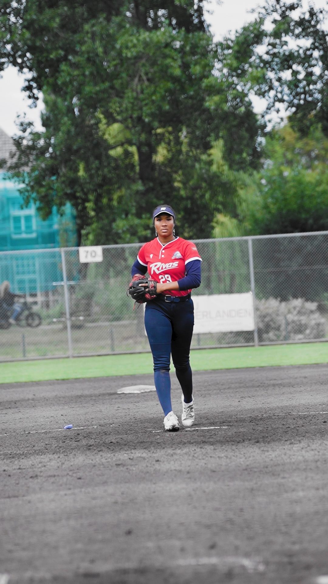 Morgan Smith pitching, Alejandrina Alcántara making the catch