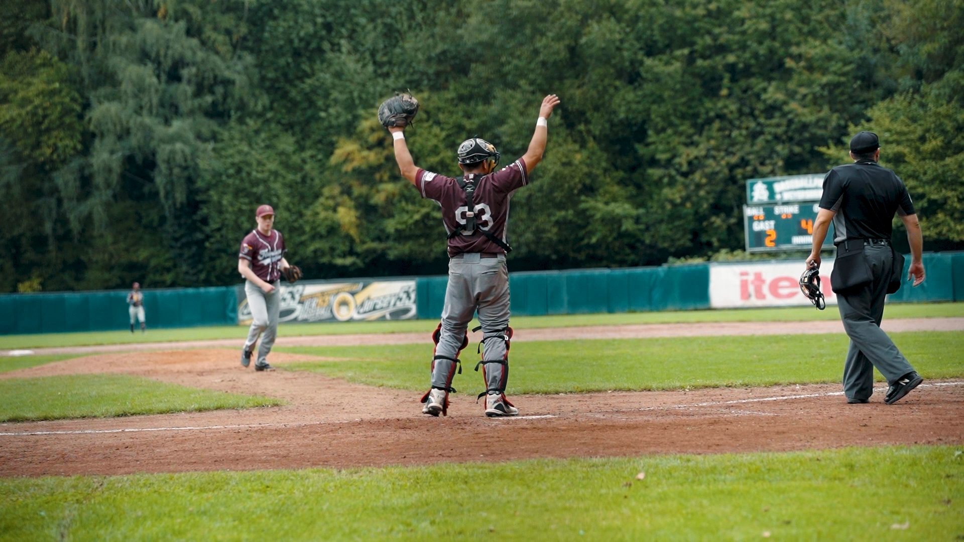 Ryne McKinney sliding headfirst home