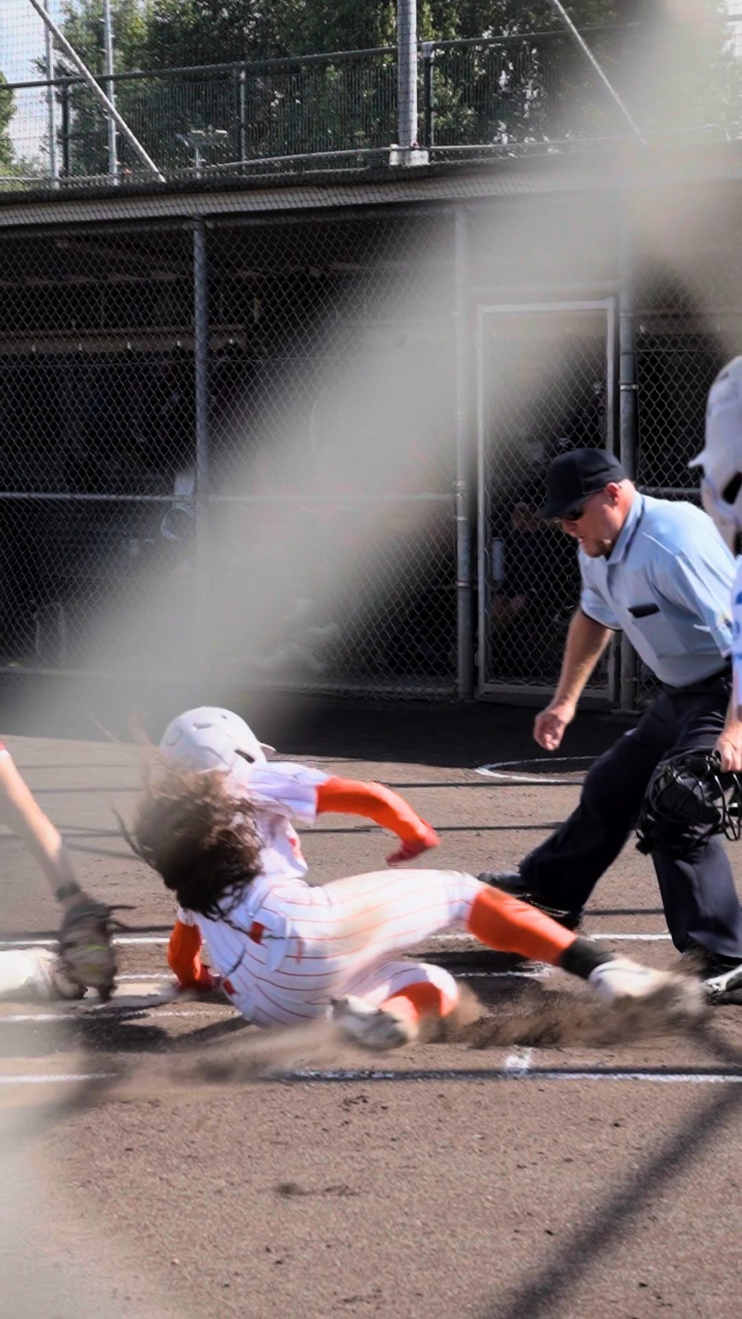 Jazmyn Jackson sliding home and celebrating