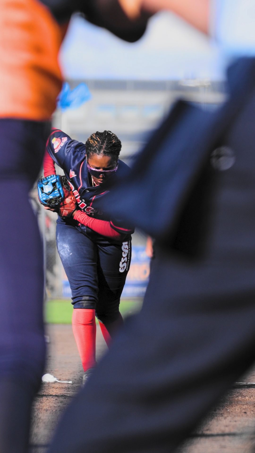 Sarah Jeanette Willis pitching for a strikeout